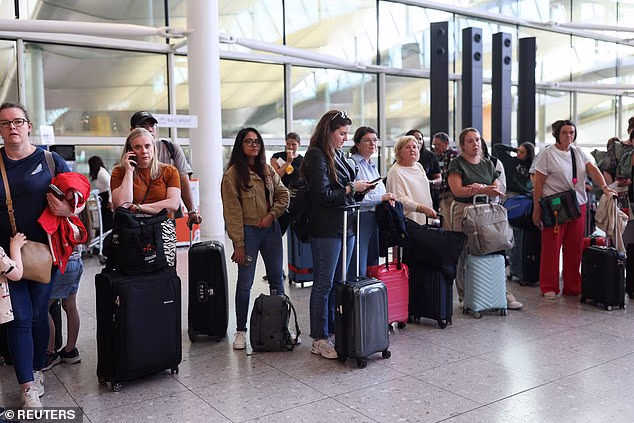 Heathrow Airport Passengers Stood Waiting When Suspension Of Outbound Flights Across Uk Was Announced