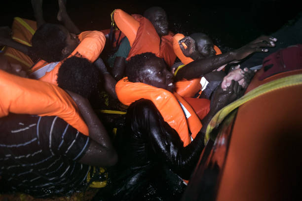 Migrants On The Verge Of Drowning Desperately Seeking For Help And Rescue