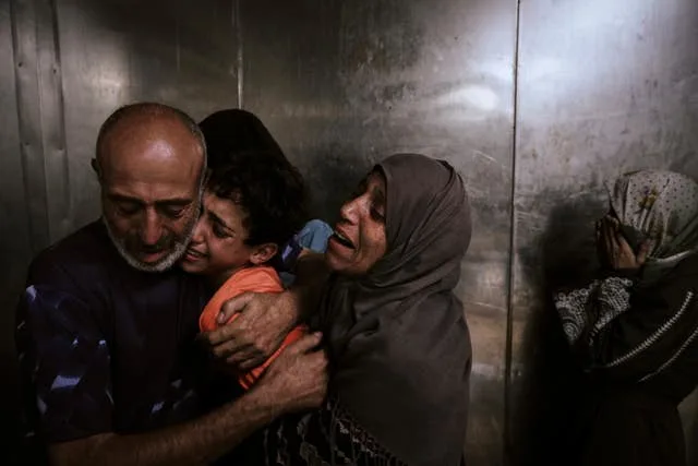 Palestinian Relatives Mourn Their Dead