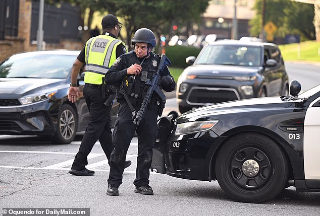 Police Officer In Readiness To Respond To The Shooting Attack