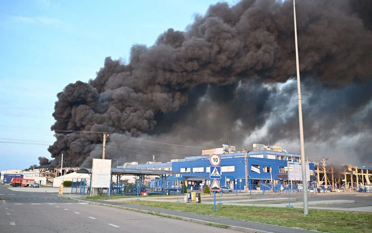 Scene Of The Attack Engulf With Dark Smoke As The Facility Burns Webp