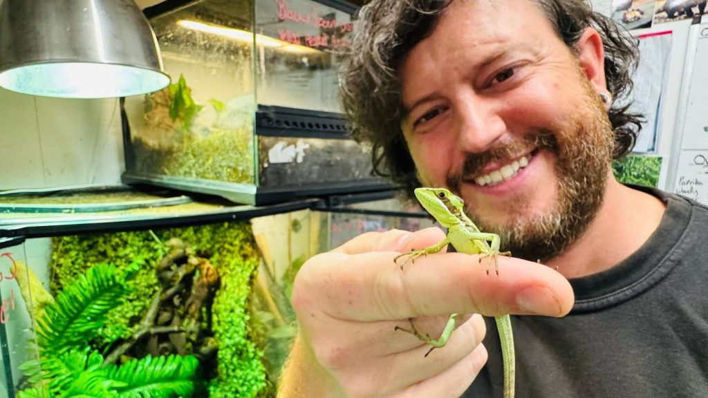 Director Of The Zoo Mark Holding On The Baby