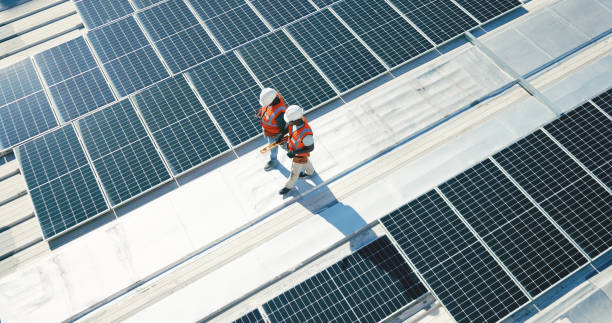 Engineers Inspecting The Solar Panel Installation At Site