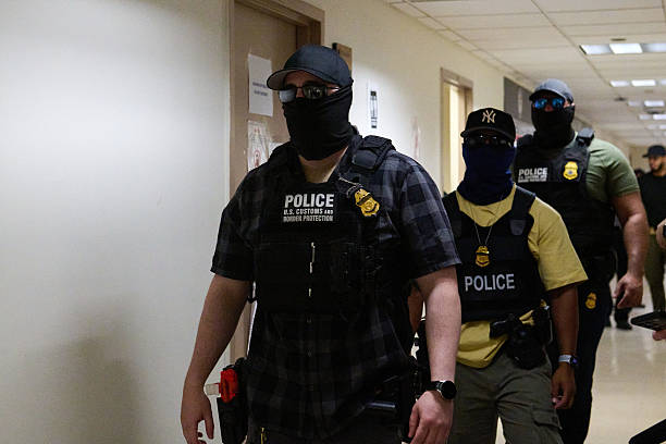 Police Officers On Mask During While Trying To Carry Out An Arrest Webp