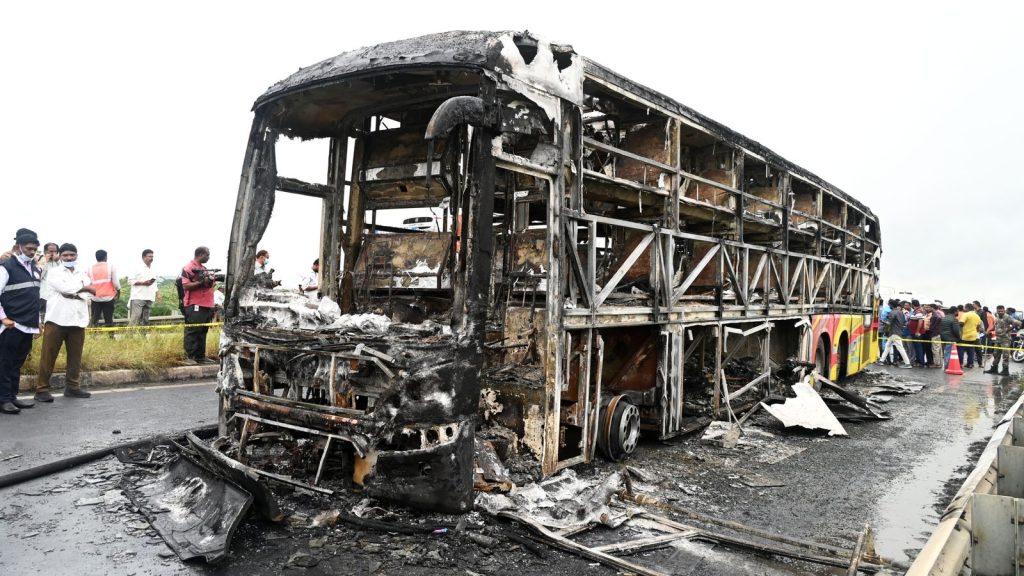 Debris Of The Bus Was Cordoned Off While People Watched From A Distance
