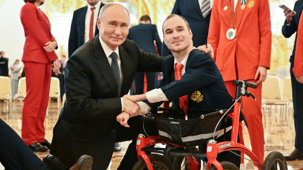 Vladimir Putin Poses For A Photo With Two Time Paralympic Silver Medallist Swimmer Vladimir Danilenko