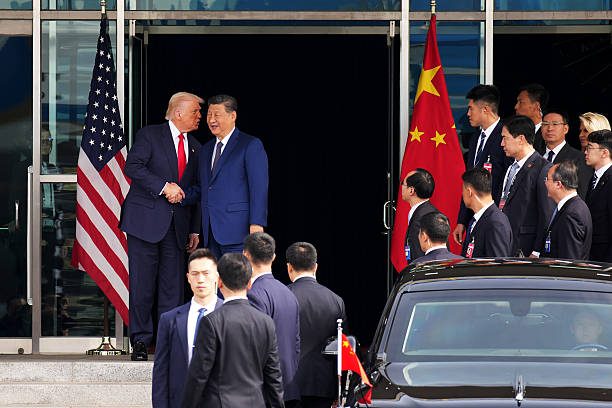 Xi Jinping And Trump In A Hand Shake Greeting Webp