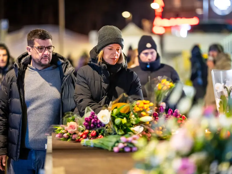 Agrieved Citizens Gathered At The Frontal Area Of The Terror Scene With Flowers As They Wore Their Mourning Looks